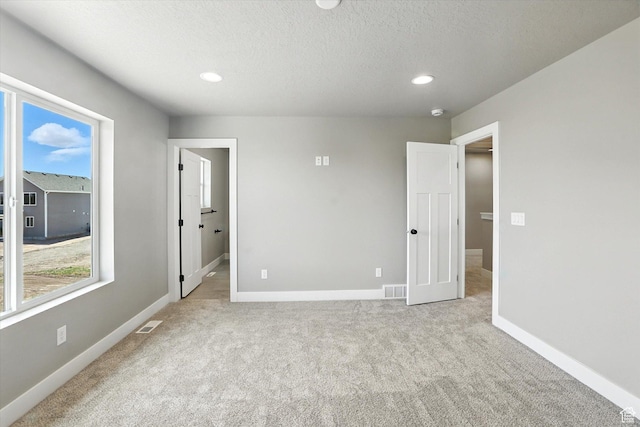 1273 S 240 W Lot 9, Tremonton, UT 84337 - unfurnished bedroom featuring carpet flooring, recessed lighting, and a textured ceiling
