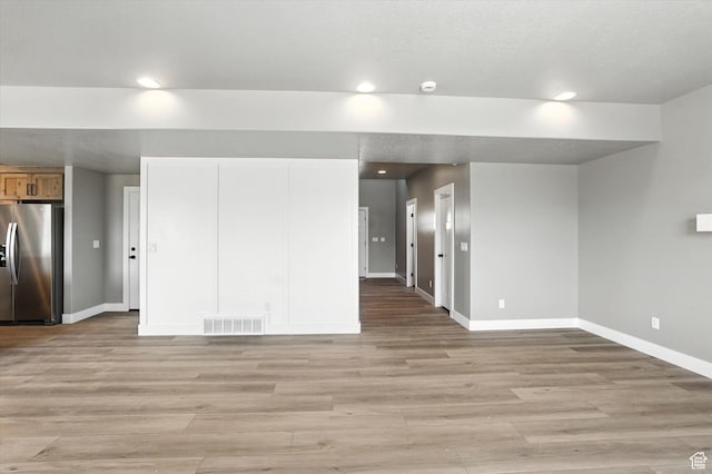 1273 S 240 W Lot 9, Tremonton, UT 84337 - unfurnished living room with recessed lighting and light wood finished floors