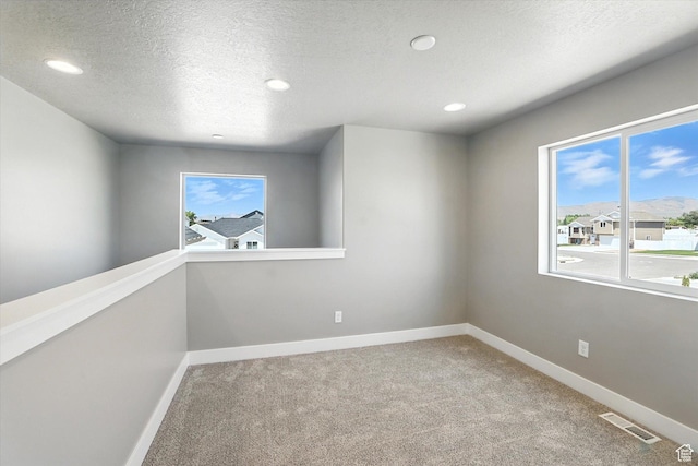 1273 S 240 W Lot 9, Tremonton, UT 84337 - spare room with carpet flooring, recessed lighting, and a textured ceiling
