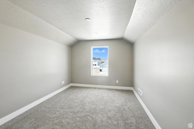 1273 S 240 W Lot 9, Tremonton, UT 84337 - bonus room with light carpet, vaulted ceiling, and a textured ceiling