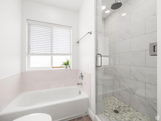 2046 N Belmont Dr, Saratoga Springs, UT 84045 - bathroom with a garden tub, toilet, and a stall shower