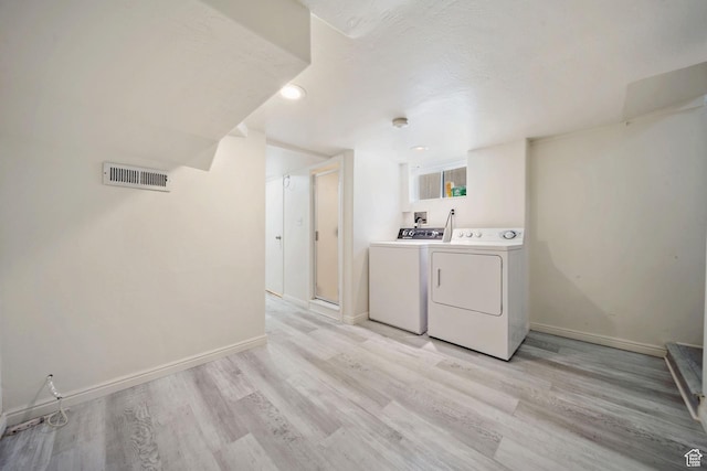 730 E 3155 S, Millcreek, UT 84106 - laundry area with independent washer and dryer, light wood-type flooring, visible vents, and baseboards