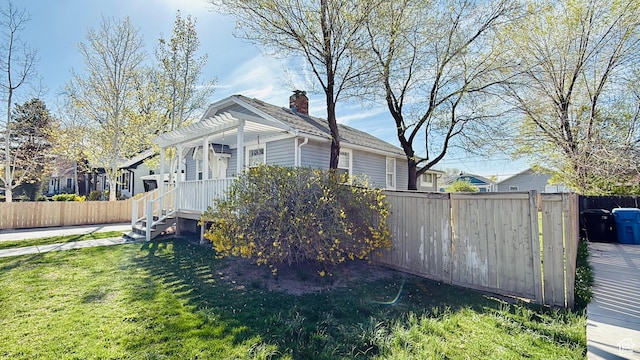 730 E 3155 S, Millcreek, UT 84106 - view of home's exterior featuring fence, a yard, and a pergola