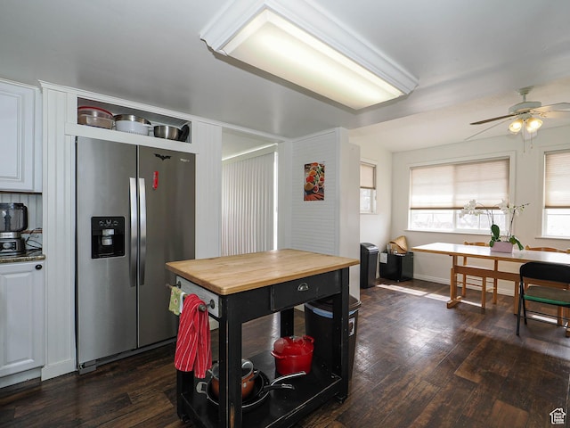 kitchen featuring butcher block countertops, stainless steel fridge, dark wood-style flooring, and ceiling fan