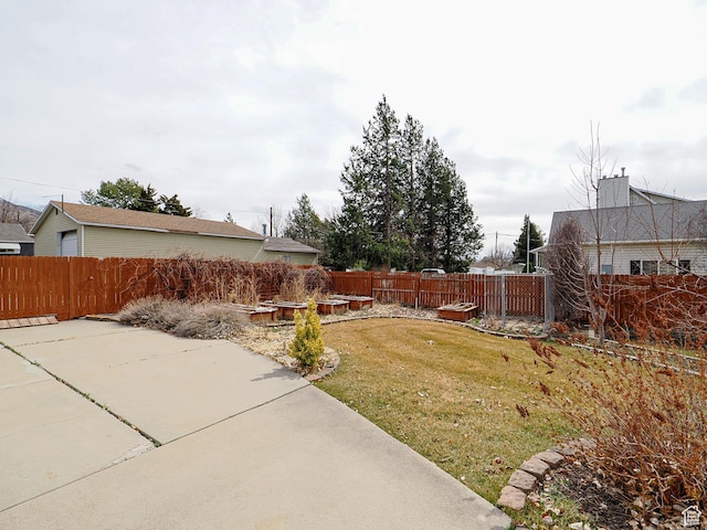 view of yard featuring a patio area and a fenced backyard