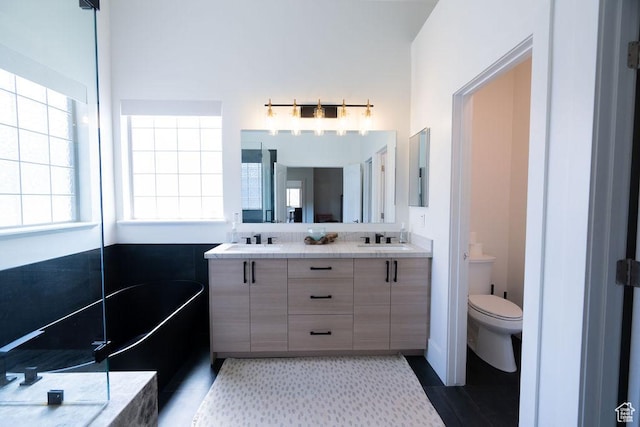 14661 S Rock Canyon Cir W, Herriman, UT 84096 - bathroom with toilet, double vanity, and a bath