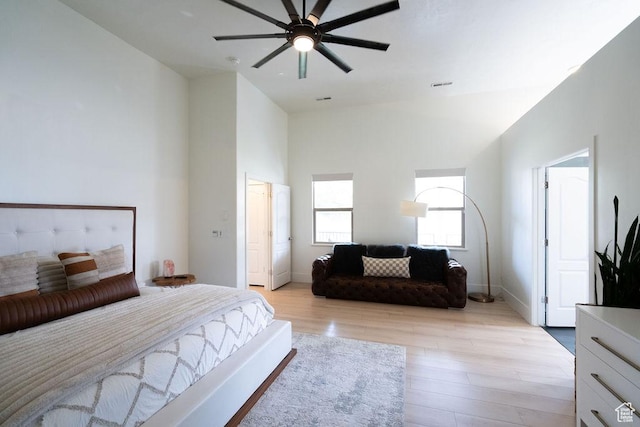 14661 S Rock Canyon Cir W, Herriman, UT 84096 - bedroom featuring light wood finished floors, a high ceiling, a ceiling fan, and baseboards