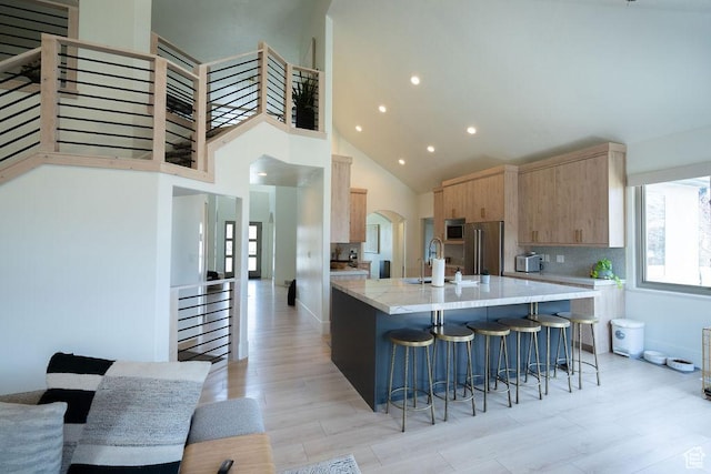 14661 S Rock Canyon Cir W, Herriman, UT 84096 - kitchen with light brown cabinets, a sink, stainless steel appliances, a large island, and recessed lighting