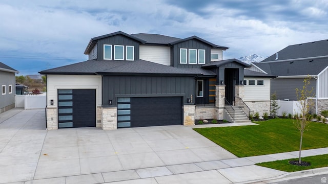 3010 W Willow Dr S, Lehi, UT 84043 - view of front of house with fence, stone siding, board and batten siding, a front yard, and driveway