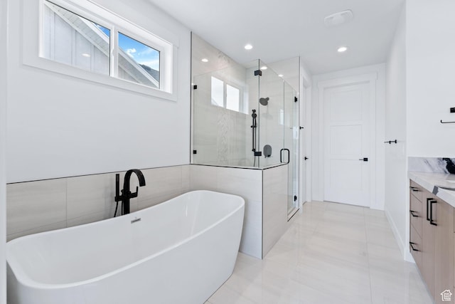 3010 W Willow Dr S, Lehi, UT 84043 - full bathroom with vanity, tile patterned flooring, recessed lighting, a soaking tub, and a stall shower