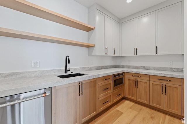 3010 W Willow Dr S, Lehi, UT 84043 - kitchen with stainless steel dishwasher, open shelves, recessed lighting, a sink, and light wood finished floors