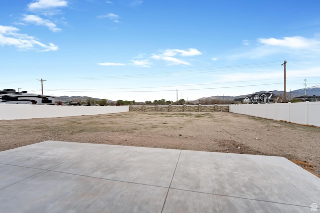 3010 W Willow Dr S, Lehi, UT 84043 - view of yard with a patio, a mountain view, and fence