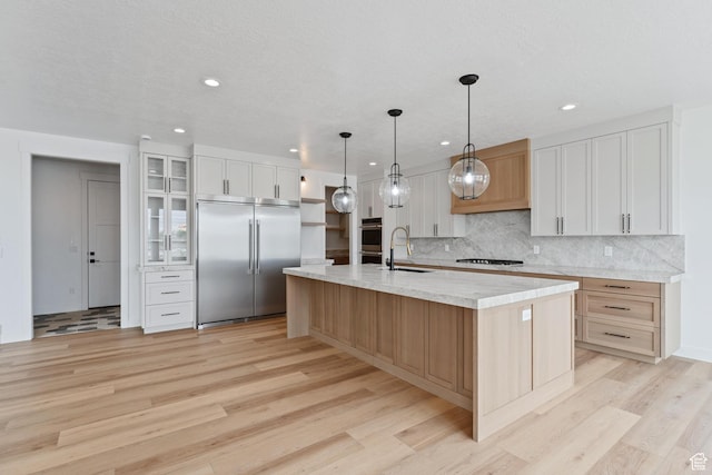 3010 W Willow Dr S, Lehi, UT 84043 - kitchen with backsplash, a large island, appliances with stainless steel finishes, light wood-style floors, and recessed lighting