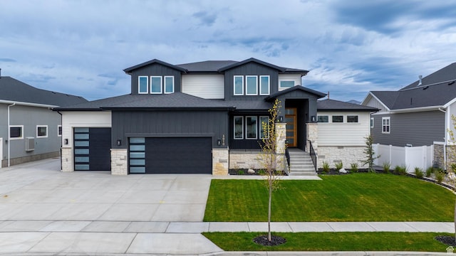 3010 W Willow Dr S, Lehi, UT 84043 - view of front of property featuring fence, an attached garage, stone siding, a front yard, and concrete driveway