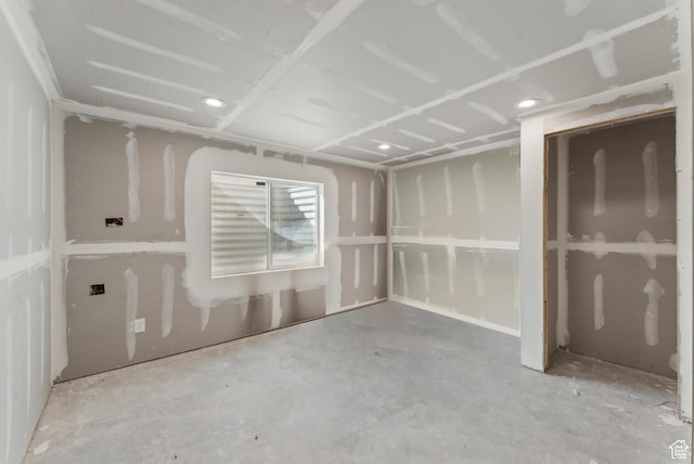spare room with concrete flooring