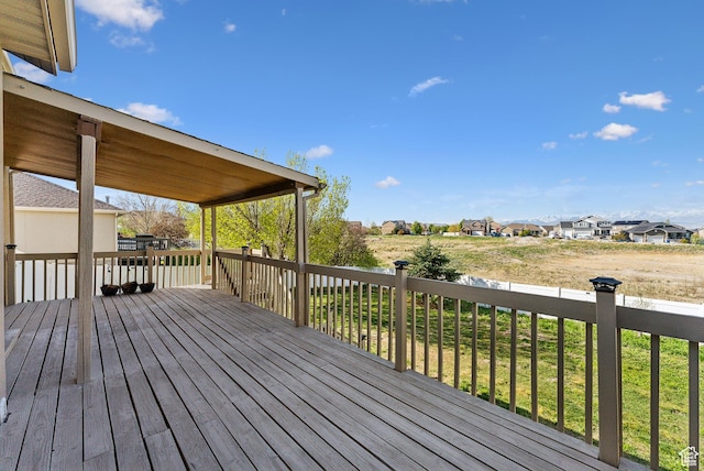 wooden deck featuring a residential view