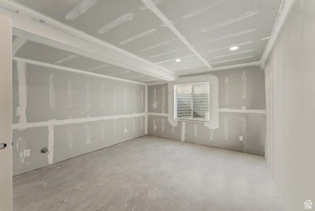 spare room with concrete floors and recessed lighting