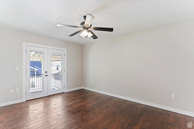 spare room with ceiling fan, french doors, baseboards, dark wood-style flooring, and visible vents