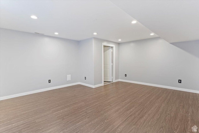 interior space featuring recessed lighting, visible vents, baseboards, and dark wood-style flooring