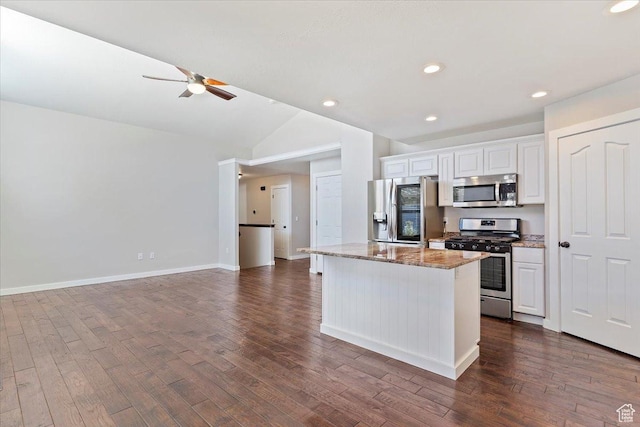 kitchen with white cabinets, a ceiling fan, stainless steel appliances, and dark wood-style floors