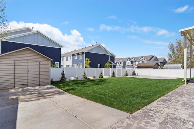view of yard with fence and a residential view