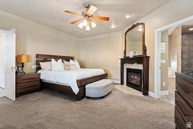 468 E 12000 S, Draper, UT 84020 - bedroom featuring light carpet, baseboards, a fireplace, light tile patterned floors, and connected bathroom