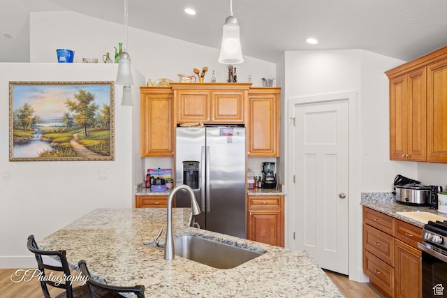 2261 S Tonaquint Dr W Unit 55, St George, UT 84770 - kitchen with stainless steel appliances, a sink, recessed lighting, light wood-style floors, and light stone counters