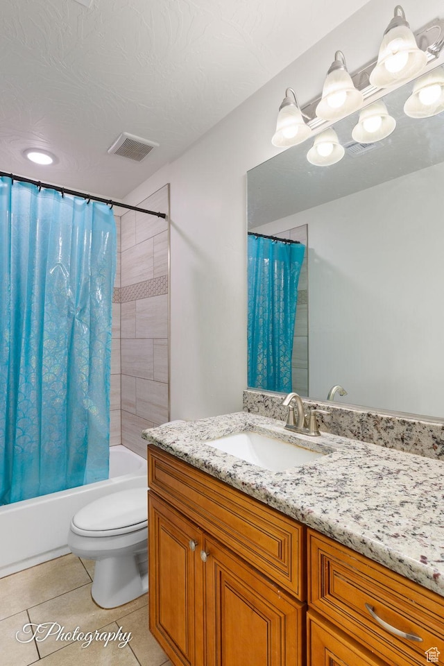 2261 S Tonaquint Dr W Unit 55, St George, UT 84770 - bathroom featuring vanity, shower / bath combination with curtain, toilet, tile patterned flooring, and visible vents