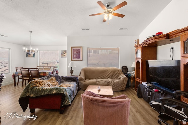 2261 S Tonaquint Dr W Unit 55, St George, UT 84770 - living area with light wood-type flooring, visible vents, and ceiling fan with notable chandelier