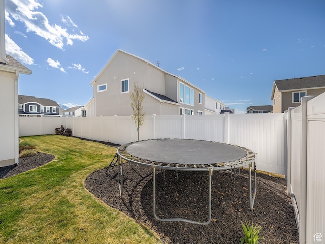 1058 S 800 W, American Fork, UT 84003 - view of yard featuring a fenced backyard, a residential view, and a trampoline