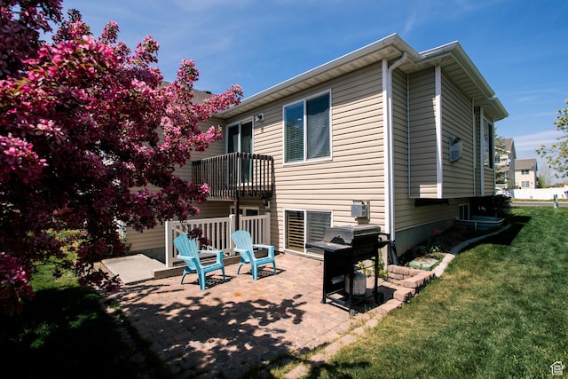 3611 W 850 S, Syracuse, UT 84075 - rear view of property with a lawn, a patio area, and a balcony