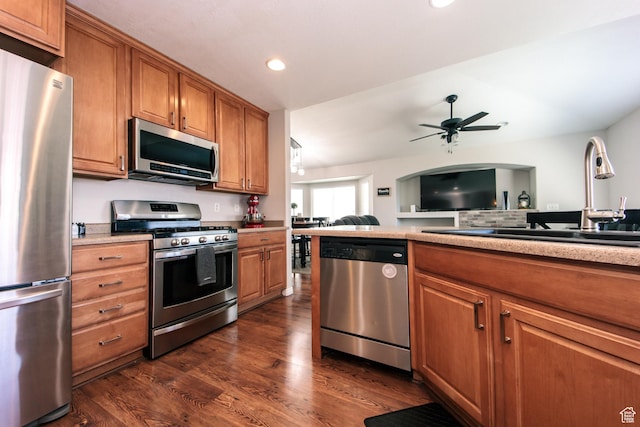 3611 W 850 S, Syracuse, UT 84075 - kitchen with stainless steel appliances, a sink, dark wood finished floors, a ceiling fan, and brown cabinets