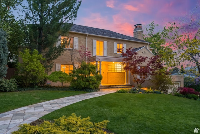 1500 E Arlington Dr, Salt Lake City, UT 84103 - view of front of property with a chimney, brick siding, and a yard
