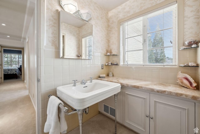 1500 E Arlington Dr, Salt Lake City, UT 84103 - ensuite bathroom with connected bathroom, backsplash, wallpapered walls, and visible vents