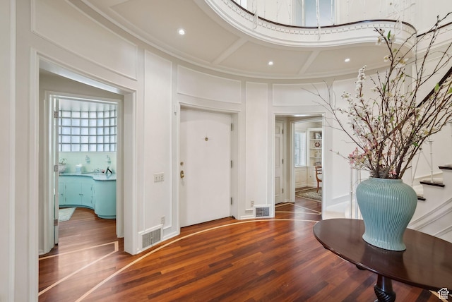 1500 E Arlington Dr, Salt Lake City, UT 84103 - foyer with visible vents, wood finished floors, a wealth of natural light, and a decorative wall