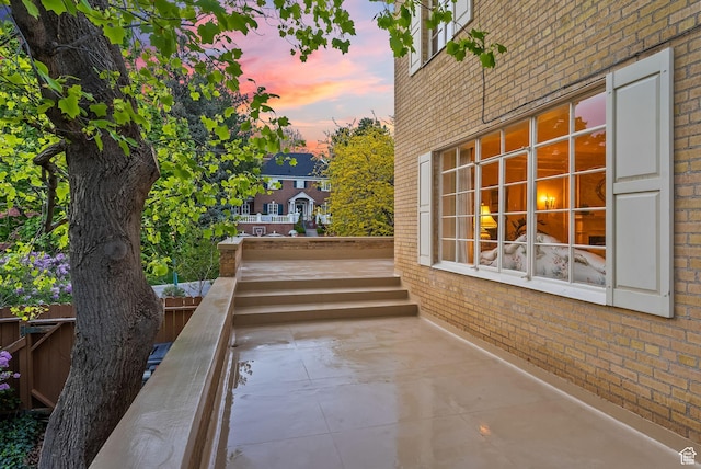 1500 E Arlington Dr, Salt Lake City, UT 84103 - view of side of home featuring fence, brick siding, and a patio