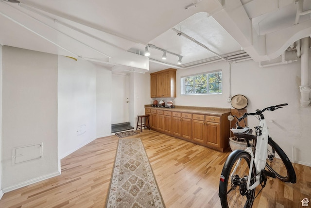 1500 E Arlington Dr, Salt Lake City, UT 84103 - exercise room featuring light wood-style flooring and baseboards