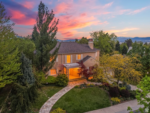 1500 E Arlington Dr, Salt Lake City, UT 84103 - view of front of property with a chimney, brick siding, and a front yard
