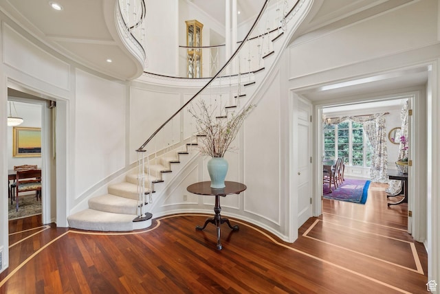 1500 E Arlington Dr, Salt Lake City, UT 84103 - foyer with stairway, a towering ceiling, wood finished floors, ornamental molding, and a decorative wall