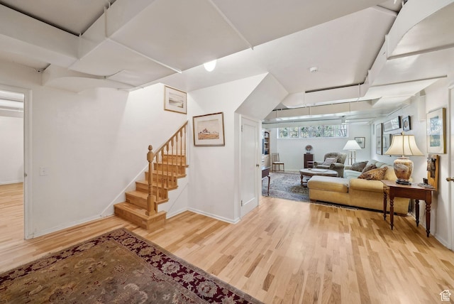 1500 E Arlington Dr, Salt Lake City, UT 84103 - living area featuring baseboards, wood finished floors, and stairway
