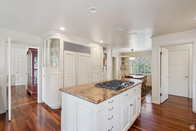 1500 E Arlington Dr, Salt Lake City, UT 84103 - kitchen featuring stainless steel gas stovetop, crown molding, dark wood-style floors, and white cabinetry