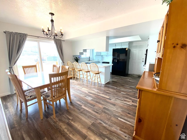 155 W 350 S, Glenwood, UT 84730 - dining area with a notable chandelier, a textured ceiling, and dark wood-style floors