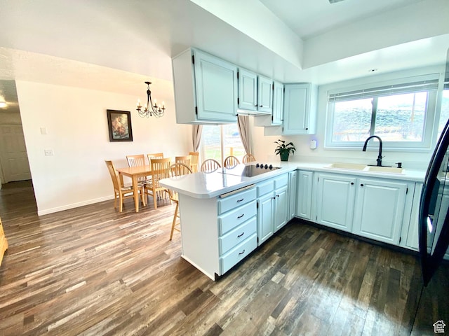 155 W 350 S, Glenwood, UT 84730 - kitchen featuring dark wood-style floors, a sink, a notable chandelier, black electric stovetop, and light countertops