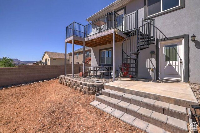 715 S Peachtree Dr, Toquerville, UT 84774 - rear view of property with a patio area, a fenced backyard, stucco siding, a wooden deck, and stairs