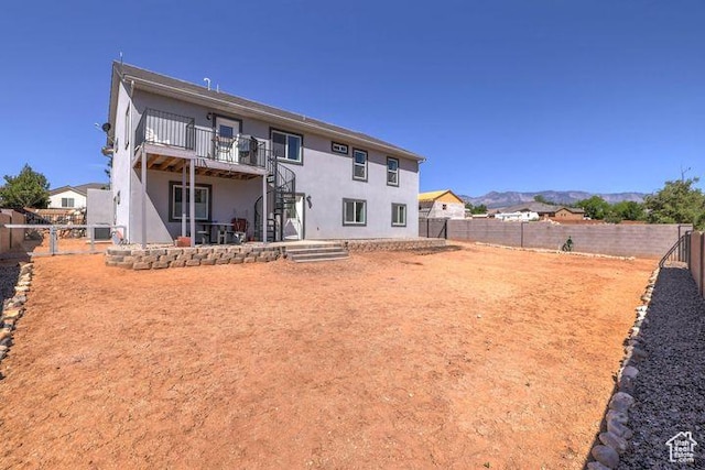 715 S Peachtree Dr, Toquerville, UT 84774 - rear view of house featuring a wooden deck, a fenced backyard, stairs, and stucco siding