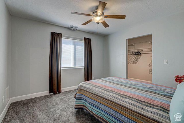 715 S Peachtree Dr, Toquerville, UT 84774 - carpeted bedroom featuring baseboards, a ceiling fan, a textured ceiling, and visible vents