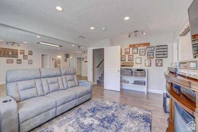 715 S Peachtree Dr, Toquerville, UT 84774 - living area featuring wood finished floors, baseboards, recessed lighting, and stairway