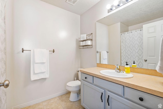 6160 S 1350 E, South Ogden, UT 84405 - full bath with tile patterned flooring, toilet, vanity, baseboards, and visible vents