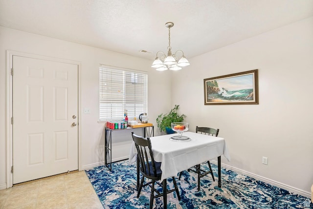 6160 S 1350 E, South Ogden, UT 84405 - dining space featuring light tile patterned flooring, visible vents, a chandelier, and baseboards