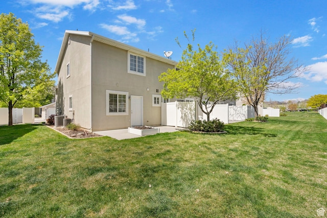 6160 S 1350 E, South Ogden, UT 84405 - rear view of house featuring a patio, stucco siding, a lawn, central AC, and a fenced backyard